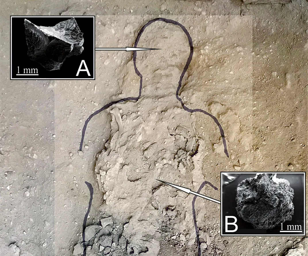 An outline of a male figure is drawn into the ground, with two images pointing to his head and chest where (A) brain tissue and (B) spinal cord tissue were discovered