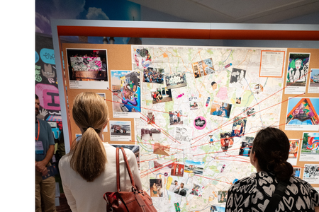 Educators gather around a map
