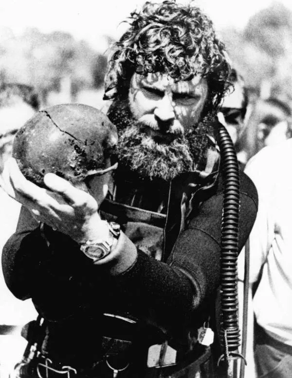 Marine archaeologist Wilburn "Sonny" Cockrell with a human skull found at Warm Mineral Springs in 1973