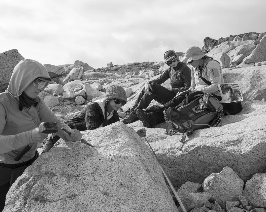 Left to right, students Megan Stewart and Anna Fatta collect samples and make measurements while Ali Dibble listens to instructor Bethan Davies.