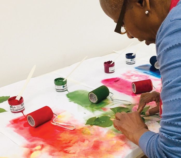 A student learns how to turn spring foliage into botanical watercolors and prints on paper in the Smithsonian Associates studio arts class, Painting and Printing: Leaves Two Ways. (Sue Fierston)