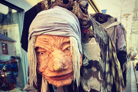 A townsperson walks around as Gryla, the Christmas Witch