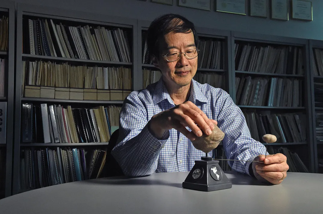 Andy Cheng with model asteroid system