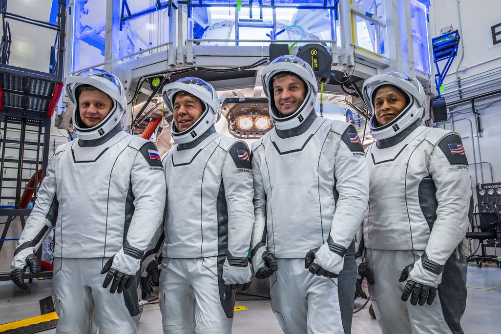 Four astronauts in space suits