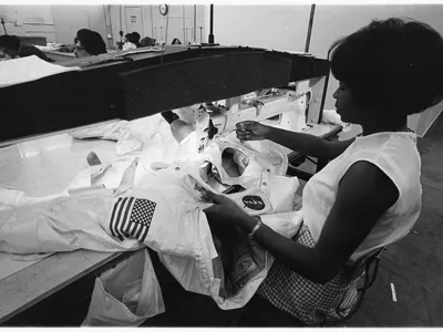 Hazel Fellows sews pieces of an Apollo A7L spacesuit on the production line at International Latex Corporation (ILC) in 1968.
