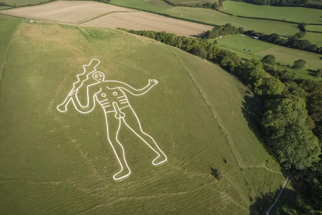 Aerial view of the Cerne Abbas Giant, a 180-foot chalk drawing of a well-endowed man