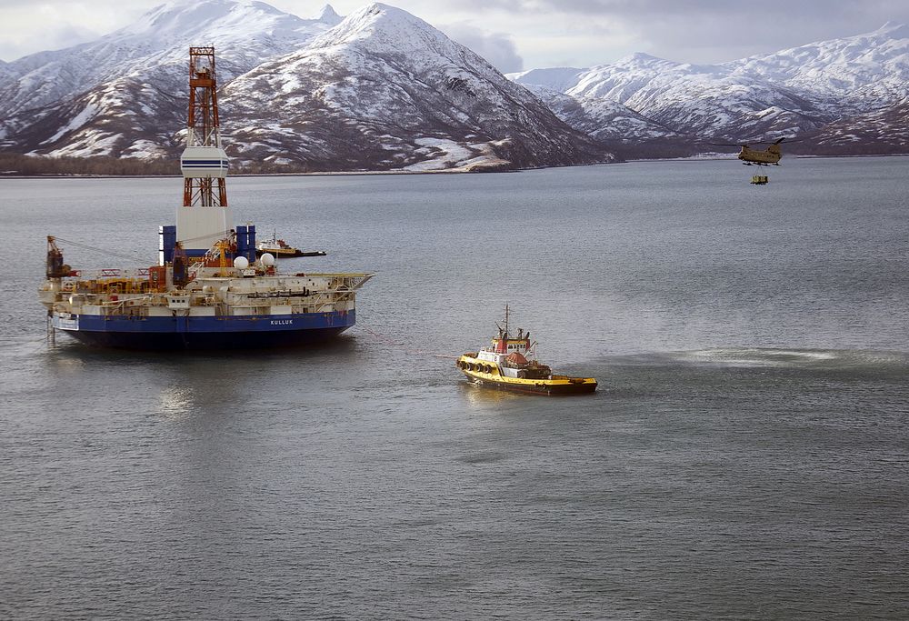 A Chinook helicopter caries supplies to the stranded Kulluk oil drilling platform in January.