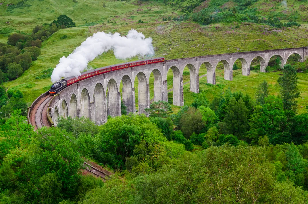 Traditional steam train at Glenfinnan Viaduct