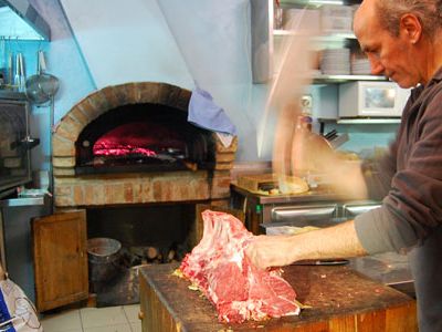 The chef at this Tuscan restaurant doubles as a butcher—he cuts the steak before he grills it.