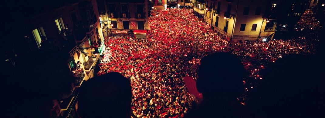 Thousands gather at midnight on July 14 in  the Plaza Consistorial for the candlelight singing of “Pobre de Mí” (“Poor Me”), the closing ceremony of the festival.