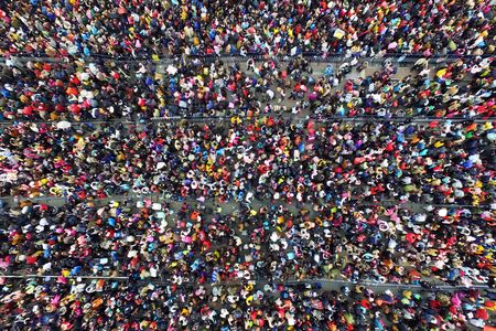 Stranded travelers line up at a train station in Guangzhou, China, where tens of thousands of people are stranded due to bad weather. 