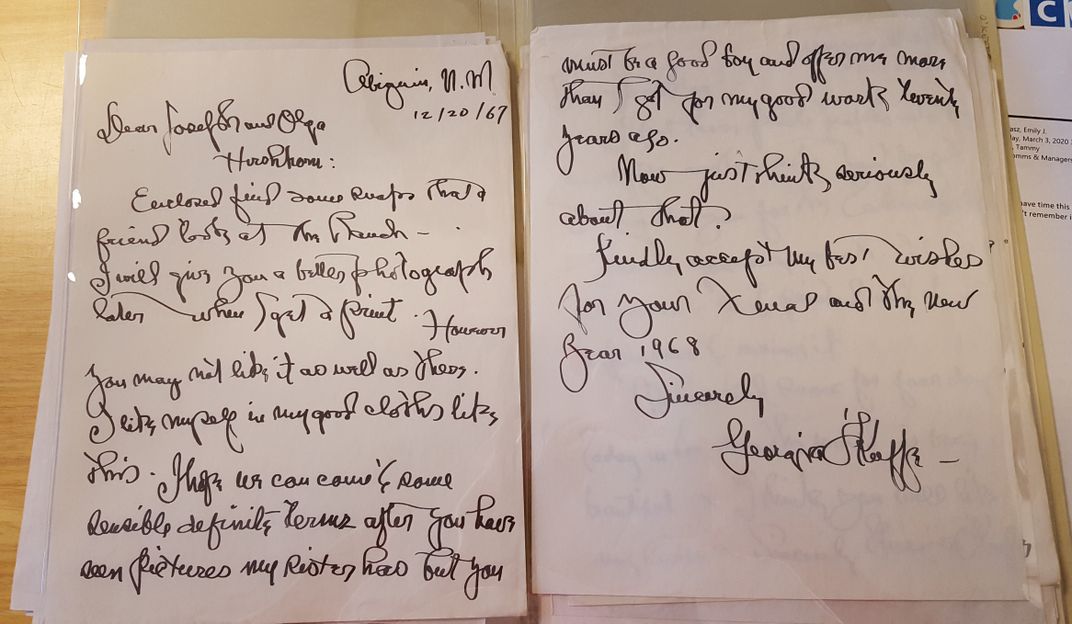 Two handwritten manuscript pages, one with Georgia O'Keefe's signature at bottom..