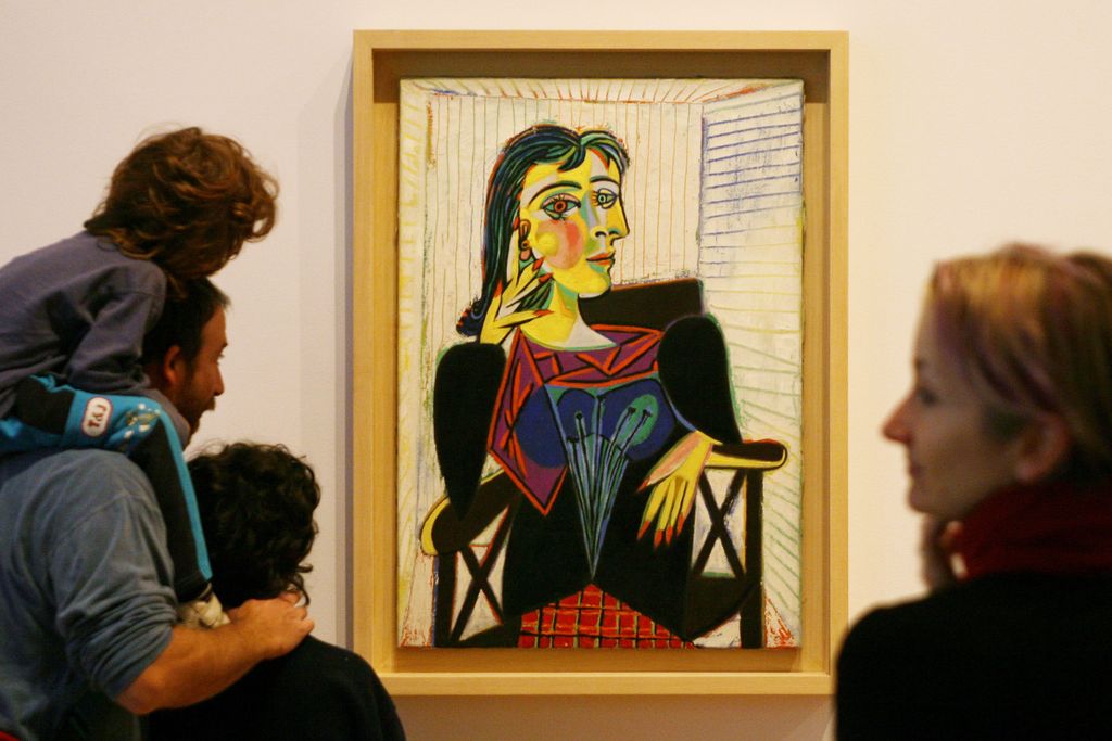 Museum visitors admire a Pablo Picasso portrait of Dora Maar.