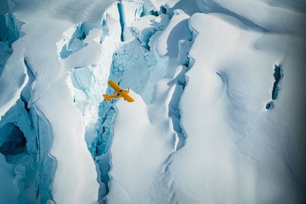 Yellow SuperCub over the Regal Glacier thumbnail