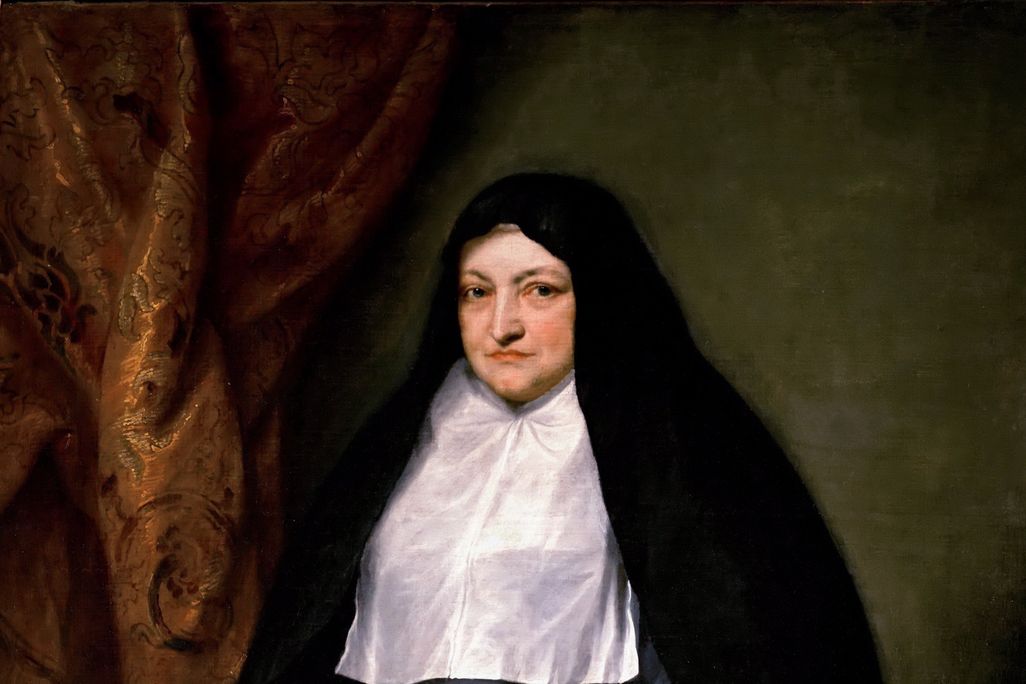 A portrait of an elderly white woman dressed in simple black and white mourning clothes, holding a black sash tied around her waist