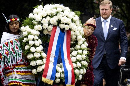 King Willem-Alexander lays a wreath as part of a ceremony on the Netherlands' National Remembrance Day of Slavery, during which he gave a speech apologizing for the country's involvement in the slave trade.