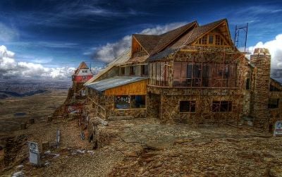 The lodge at Bolivia’s Chacaltaya Glacier was once the world’s highest ski resort—until the glacier melted away almost entirely in just 20 years. The lodge closed its ski facilities in 2009 and stands today amid a rocky, almost snowless moonscape.