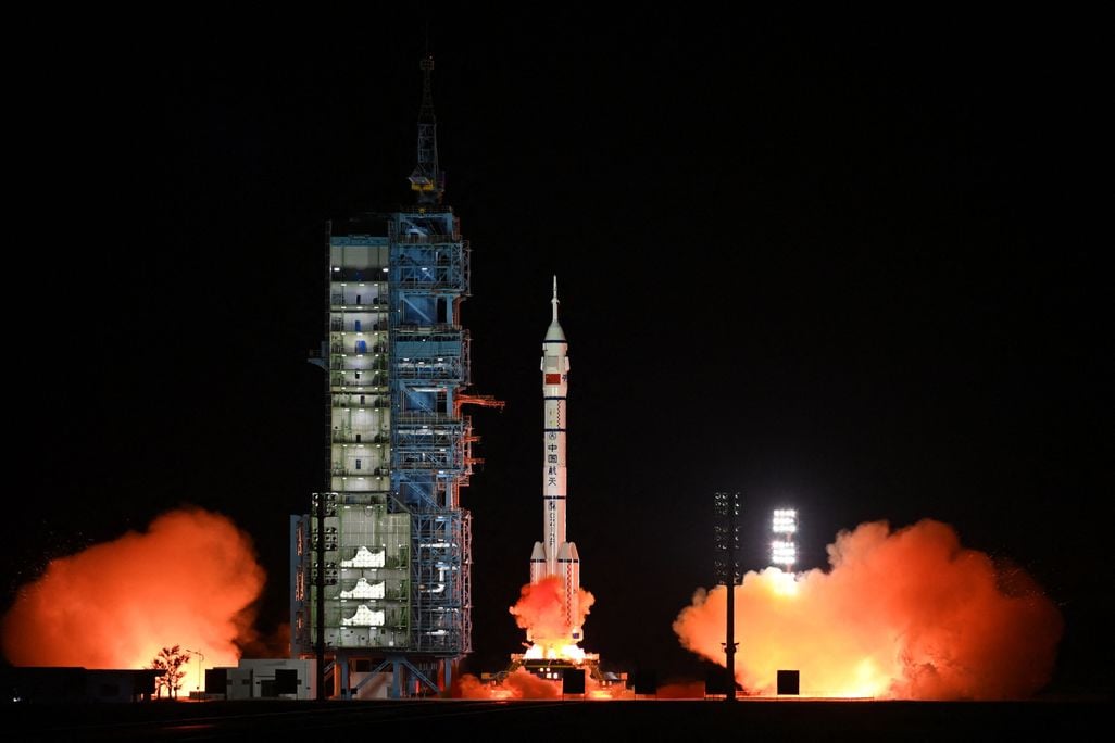 The rocket carrying the spacecraft with the three Chinese astronauts lifts off from Earth