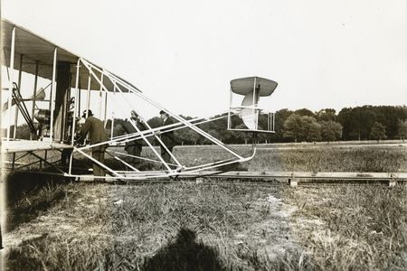 Charles Furnas at age 28 (bending over controls), when he helped the Wrights sell their Model A biplane to the Army at Fort Myer, Virginia.