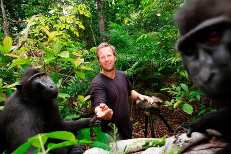 Photographer David Slater posing with crested black macaque