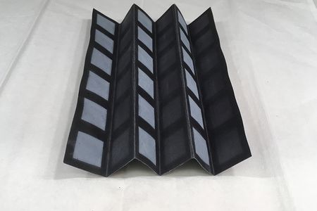 The structure of the battery is formed from a sheet of chromatography paper, divided into a grid of creases.