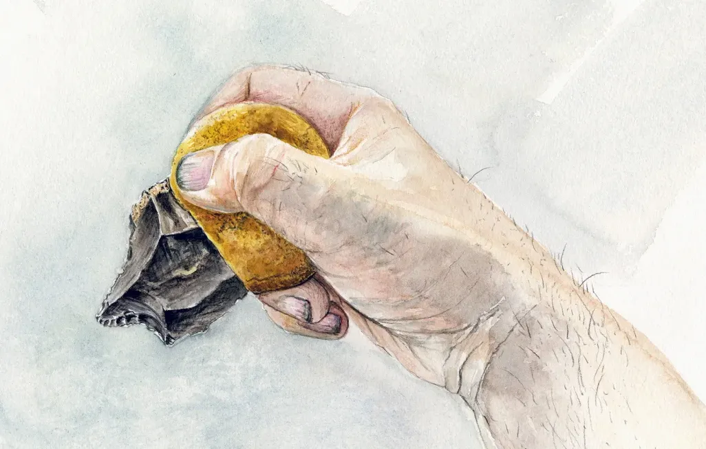 An artist's color illustration of a human hand holding a stone tool, with a handle made from ochre and bitumen