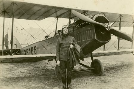 We know that Elmo Pickerill, here with a Curtiss JN-4H Jenny, was a U.S. Army Air Service lieutenant in 1918. About his claims to earlier flights, we’re not so sure.