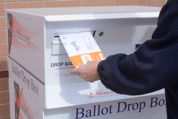 Voter dropping of mail ballot at drop box thumbnail