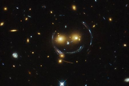 These galaxies are smiling at you thanks to general relativity.