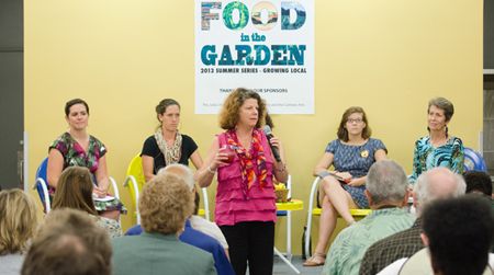 The panel at Food in the Garden’s August 1 event prepares to delve into the issues surrounding community garden and food education.