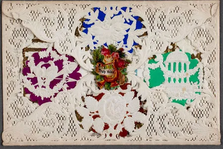 Esther Howland popularized and mass-produced Valentine's Day cards like this one, using lace and colorful paper.