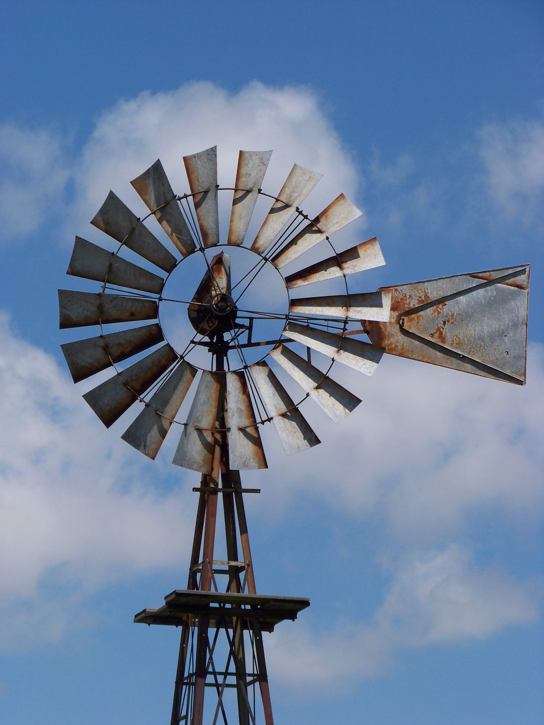 A windmill, now rusting into the past, is representative of the many ...