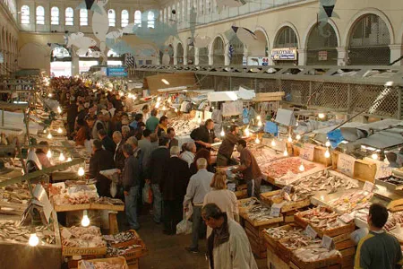 The massive neoclassical market is divided into rows of icy seafood stalls and, in the attached building, kiosks filled with cuts of meat and butcher blocks.