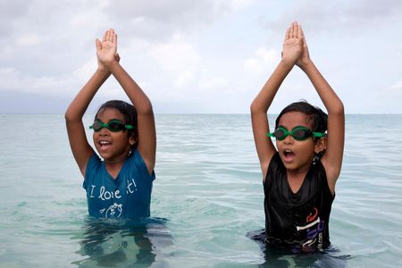 Twins Ida and Irene practice swimming in a learn-to-swim program on Eydhafushi, an island in the Maldives. 