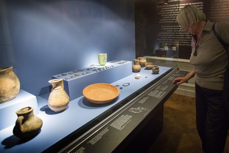 A visitor examines artifacts from the exhibition "Crimea: Gold and Secrets of the Black Sea" at the Allard Pierson Museum in Amsterdam in 2014.
