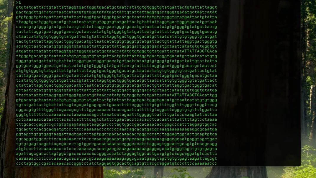 the frog's genome in green text on a dark screen