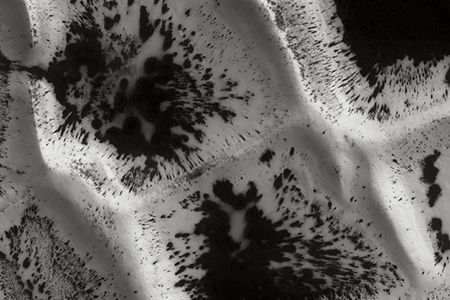 Defrosting the Crests of Inca City, LAT: -81.5° LONG: 296.3°  “The nature of this polygonal network, unique on Mars, remains poorly understood, but seems to be linked to volcanic dykes covered by eolian sand. These terrains are close to the South pole and undergo springtime defrosting in dark patches that become progressively larger as temperatures climb,” writes geophysicist Nicolas Mangold in This is Mars.