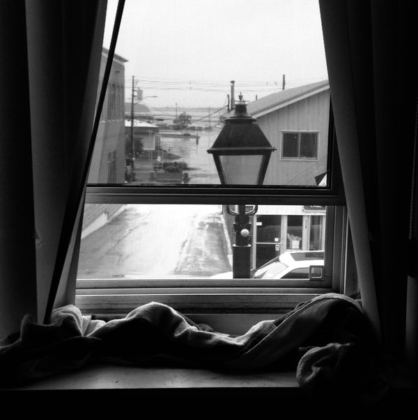 Black and white composition at a window overlooking the Street thumbnail