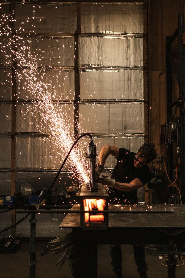 Metal worker and artist, Drew Shook, in his workshop. thumbnail