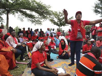 A 'Bring Back Our Girls' campaigner addresses supporters at the Unity Fountain, on the 100th day of the abductions of more than 200 school girls by the Boko Haram, in Abuja on July 23, 2014.