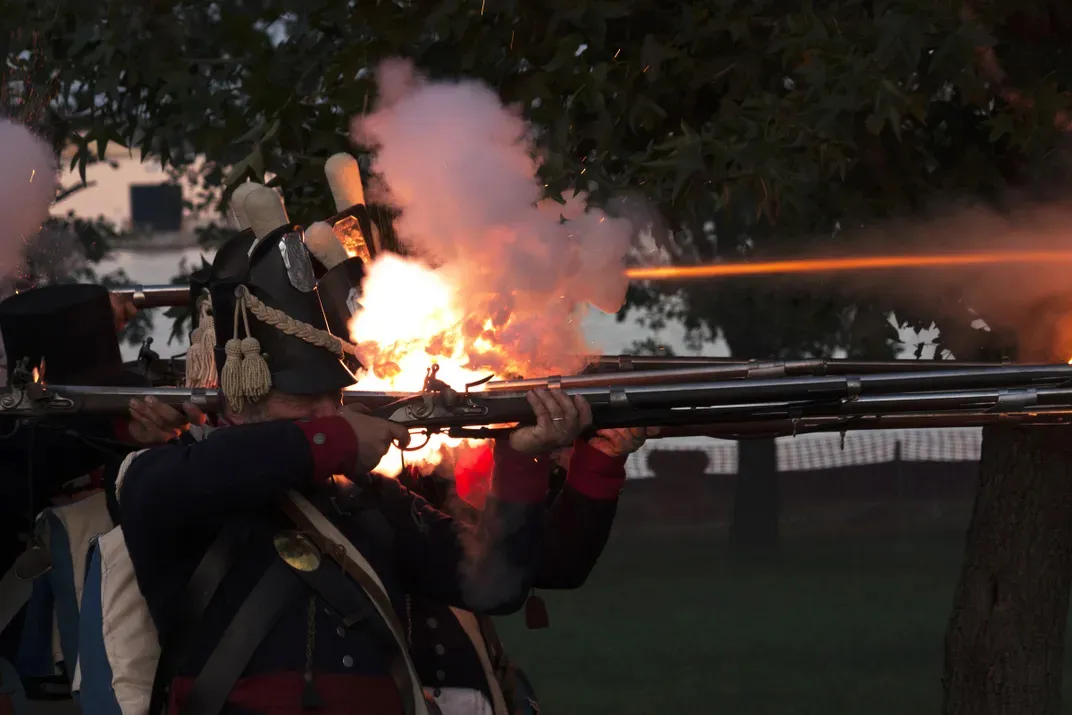 4 - Wearing Colonial-era uniforms, men at Fort McHenry fire arms in celebration of Defenders’ Day—Baltimore’s oldest holiday, which honors the city’s successful defense from British attack in 1814.
