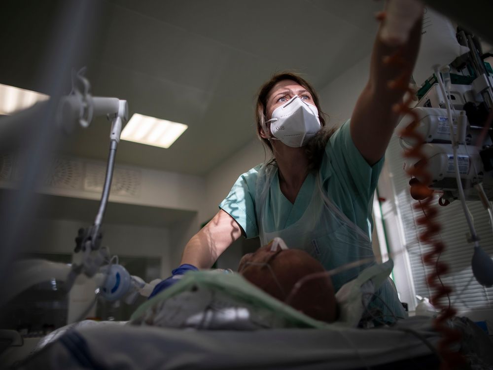 A healthcare worker takes care of a post-covid patient in the ICU ward at Hospital Karvina-Raj on January 11, 2020 in Karvina, Czech Republic. 