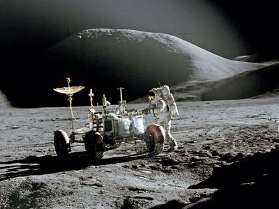 Jim Irwin and rover on moon