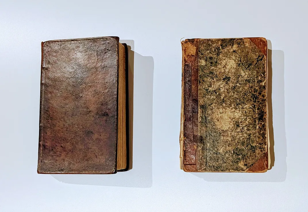 Reddish brown books on white surface