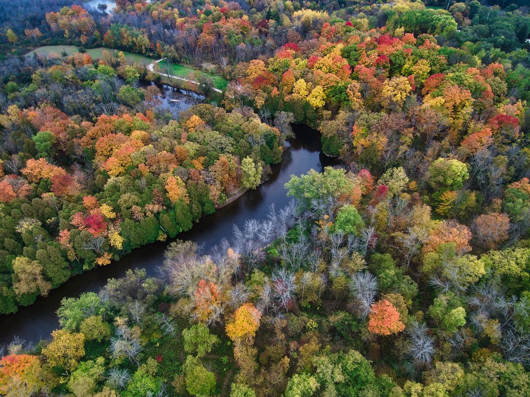 1 - Trees full of brilliant fall colors surround the Milwaukee River.