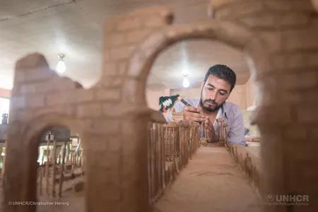 Mahmoud Hariri, from the city of Dara'a, is building a replica of the city of Palmyra from clay and wooden skewers.