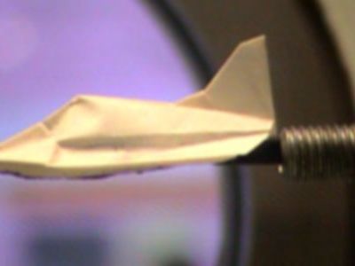 Testing a small-scale prototype of the space paper airplane in the University of Tokyo's hypersonic wind tunnel.
