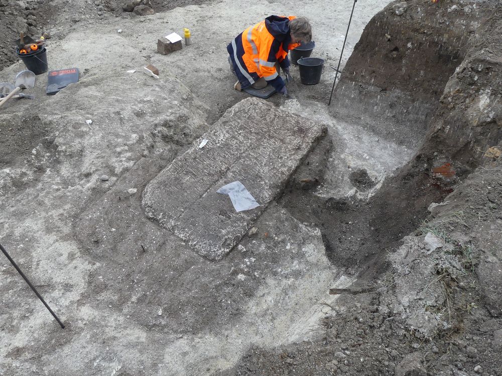 Limestone sarcophagus being excavated