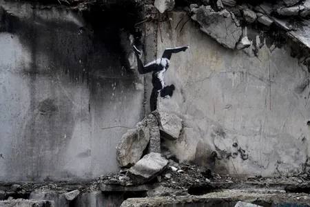 The mural was painted on the side of a building damaged by Russian airstrikes.&nbsp;