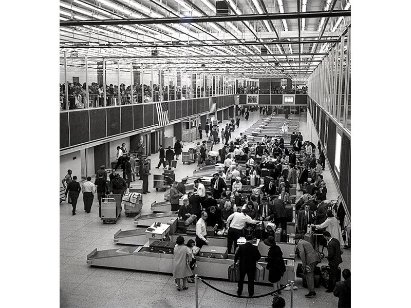 grabbing luggage from an old-fashioned carousel